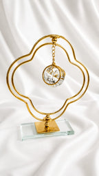 Elegant Gold Quatrefoil Stand – Hanging Crystal Sphere on Glass Base