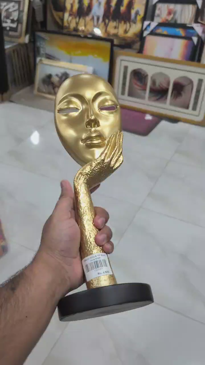 Gold Abstract Face & Hand Sculpture with Black Base