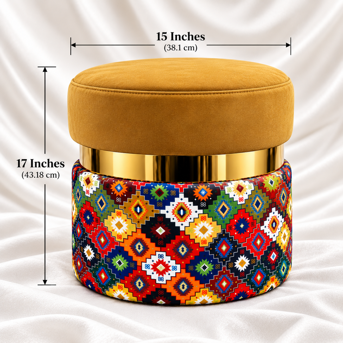 Mustard gold velvet ottoman stool with geometric fabric base, measuring 17 inches in height and 15 inches in diameter, with gold accent detail.