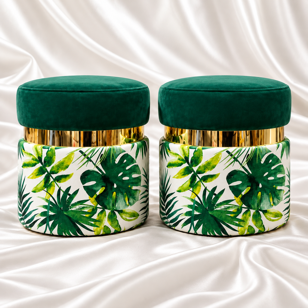 Pair of luxury emerald green velvet ottoman stools featuring tropical botanical leaf print, polished gold-tone bands and elegant round design – Decoreway.
