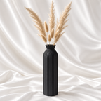 9-inch luxury black ribbed tall decorative vase for modern home décor, styled with beige dried pampas stems.