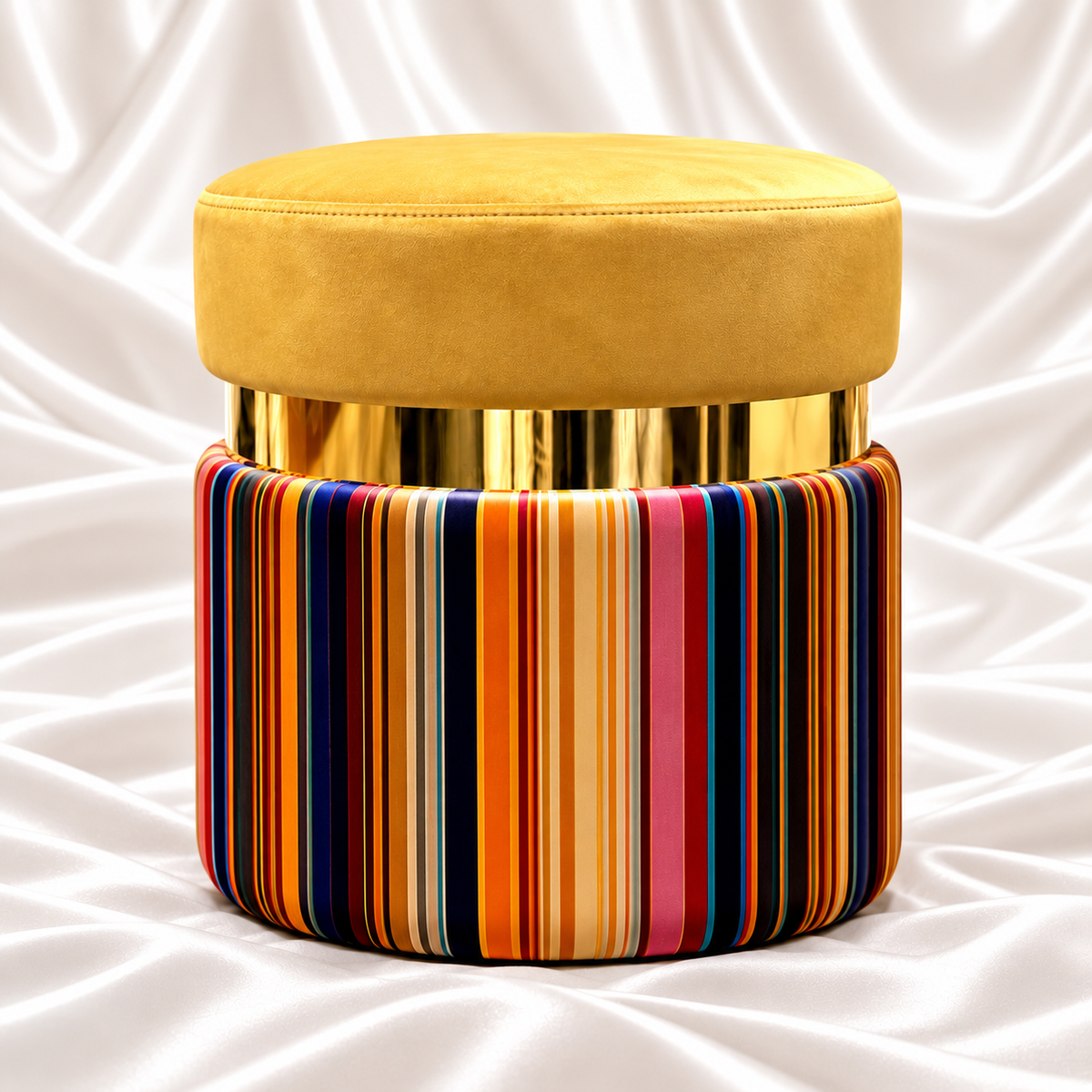 Luxury mustard velvet ottoman stool with gold accent band and multicolor striped round base on white satin background