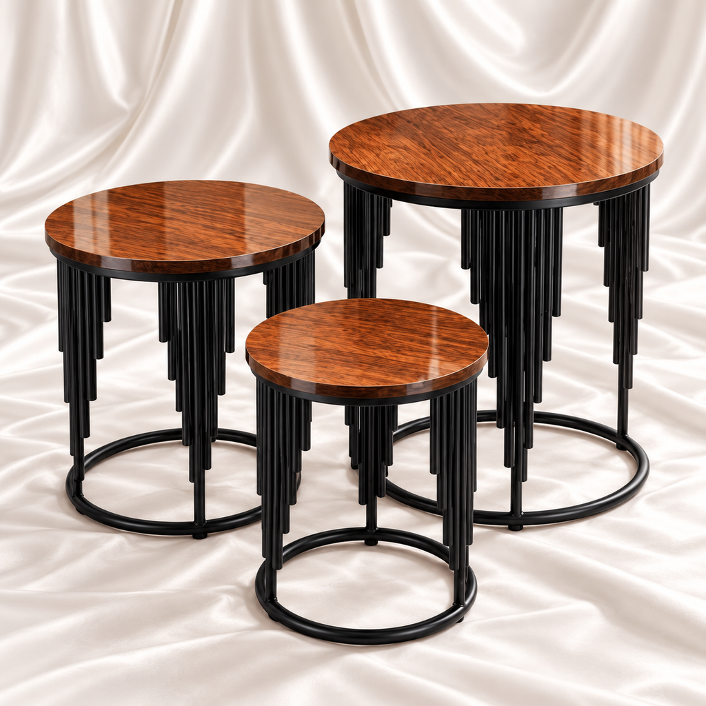 Three round brown woodgrain tables with cascading black metal rod detailing and circular bases, arranged on white satin fabric.