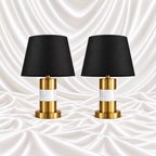 Pair of 28 inch luxury black and gold marble table lamps with black shades displayed on a white satin fabric background.