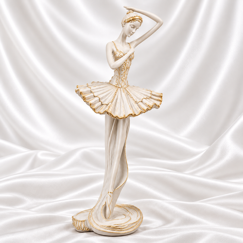 Ivory White Ivory white ballerina sculpture with gold detailing on a white satin background. A vertical measurement line shows its height of 34 inches.
