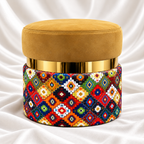 Single mustard gold velvet round ottoman stool with polished gold accent band and vibrant multicolour geometric patterned base by Decoreway.