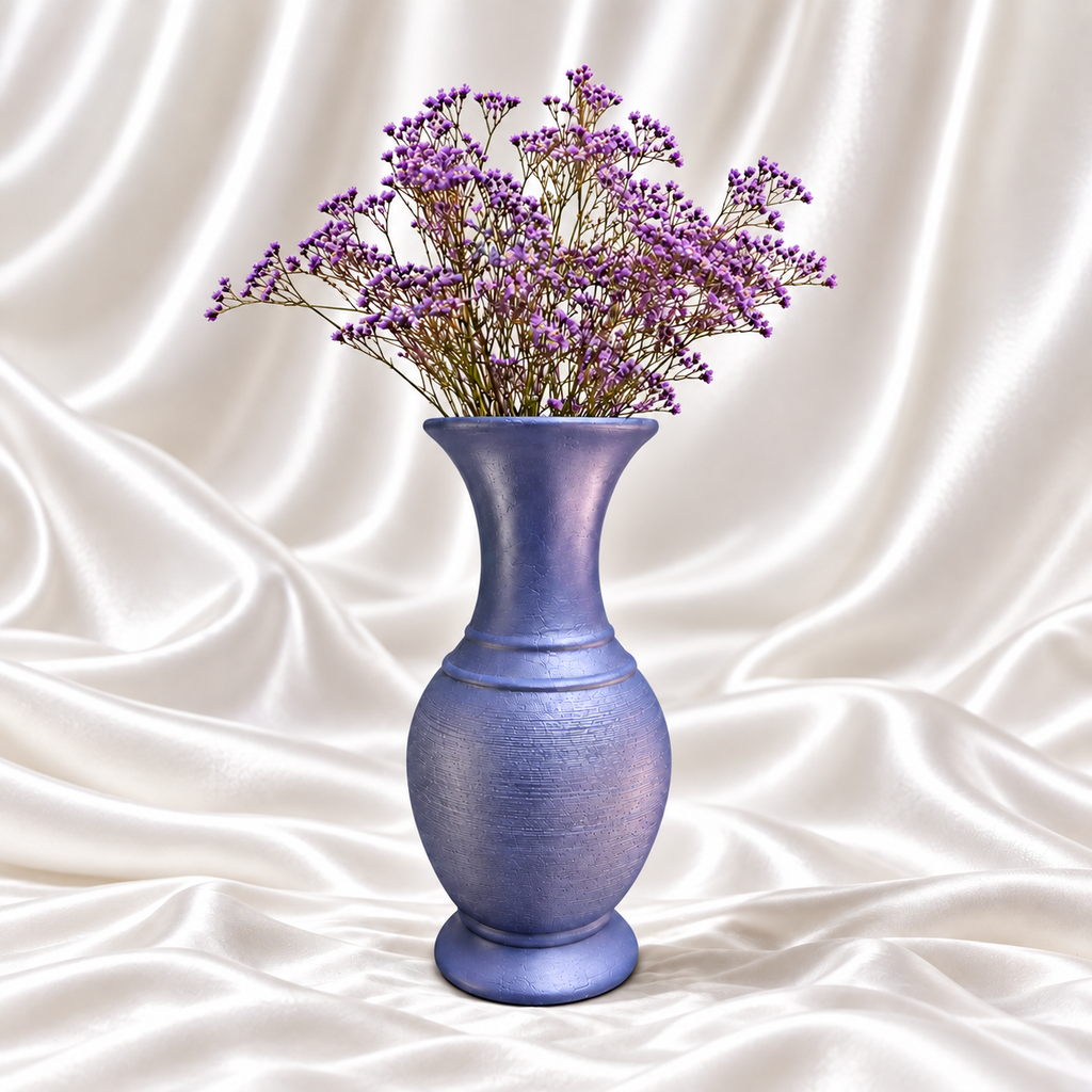 10-inch periwinkle blue decorative vase with a textured body and purple flowers on a white satin background.
