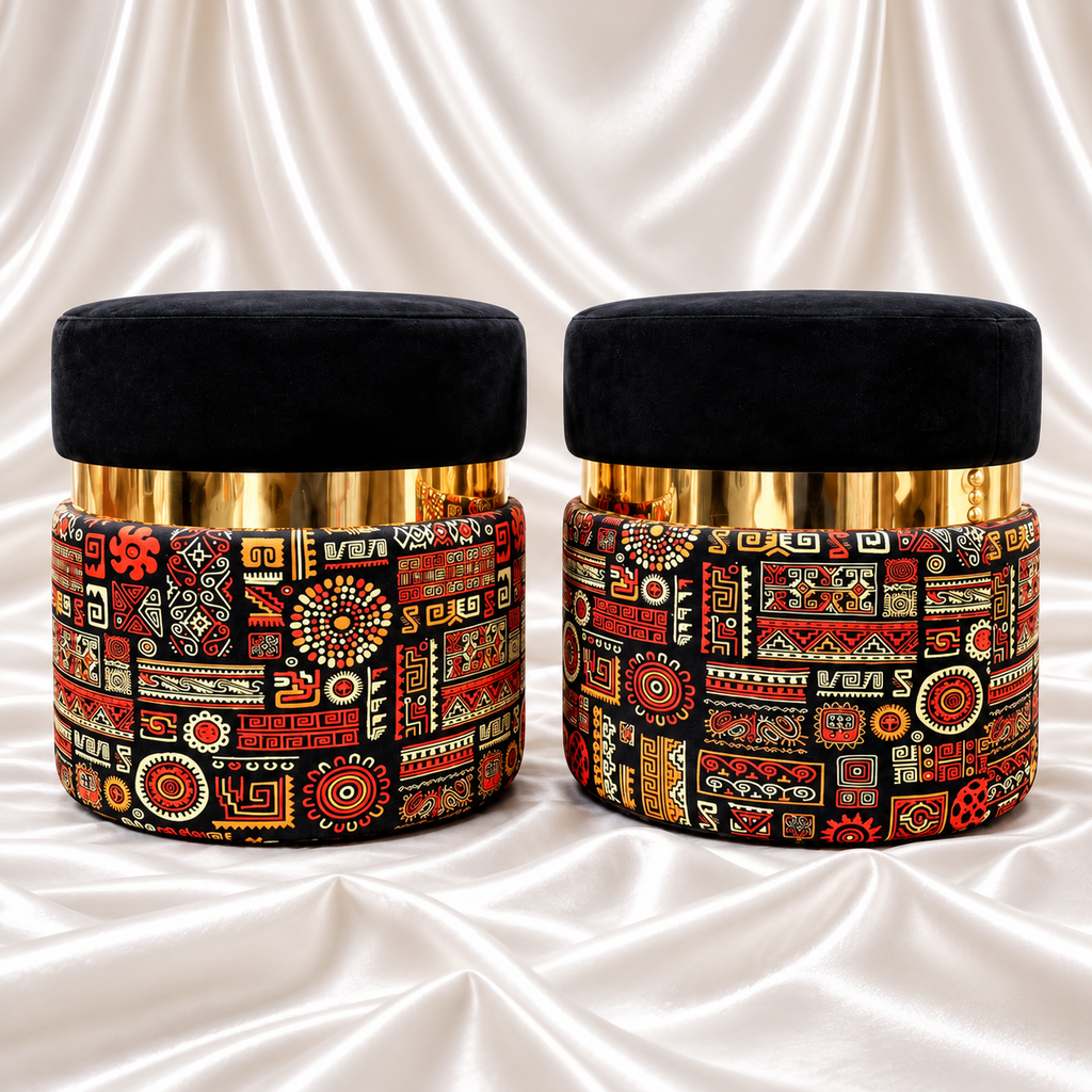 Pair of black velvet ottoman stools with gold-finish accents and multicolour geometric printed bases.