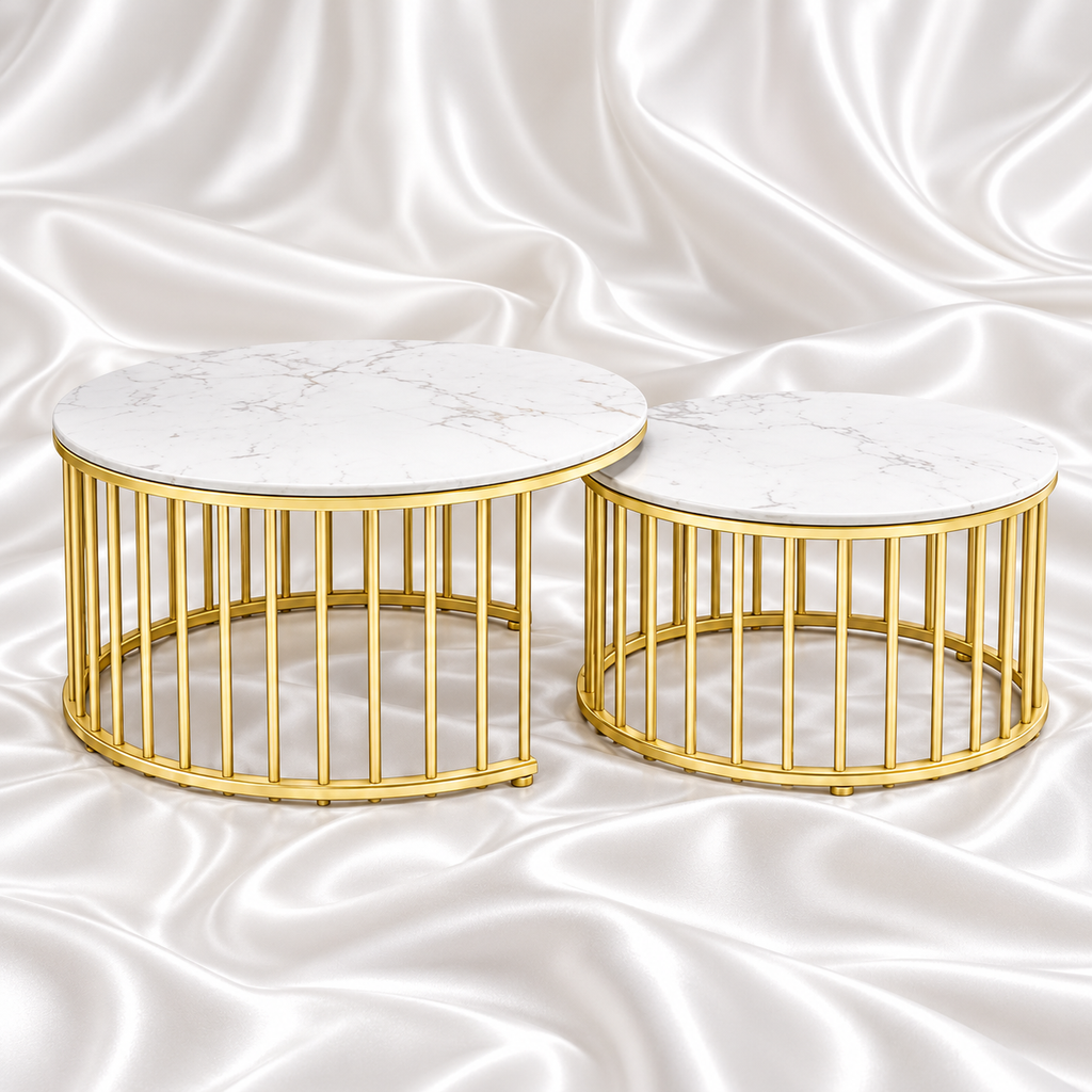 Two round nesting coffee tables with white marble-effect tops and gold-tone cage bases on a white satin background.