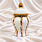 Single white decorative jar with a lid, raised panels, and gold-tone accents